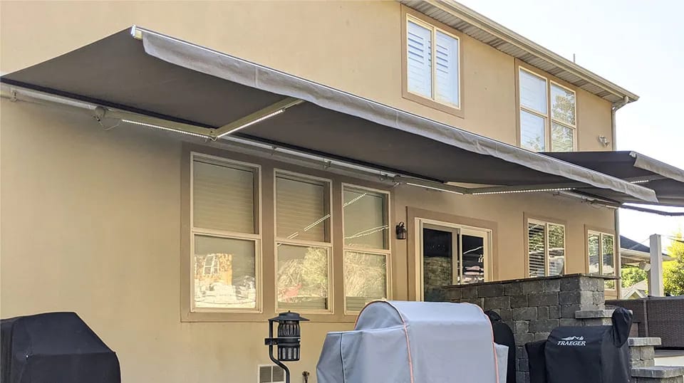 Utah Retractable Awnings installers working on an exterior project