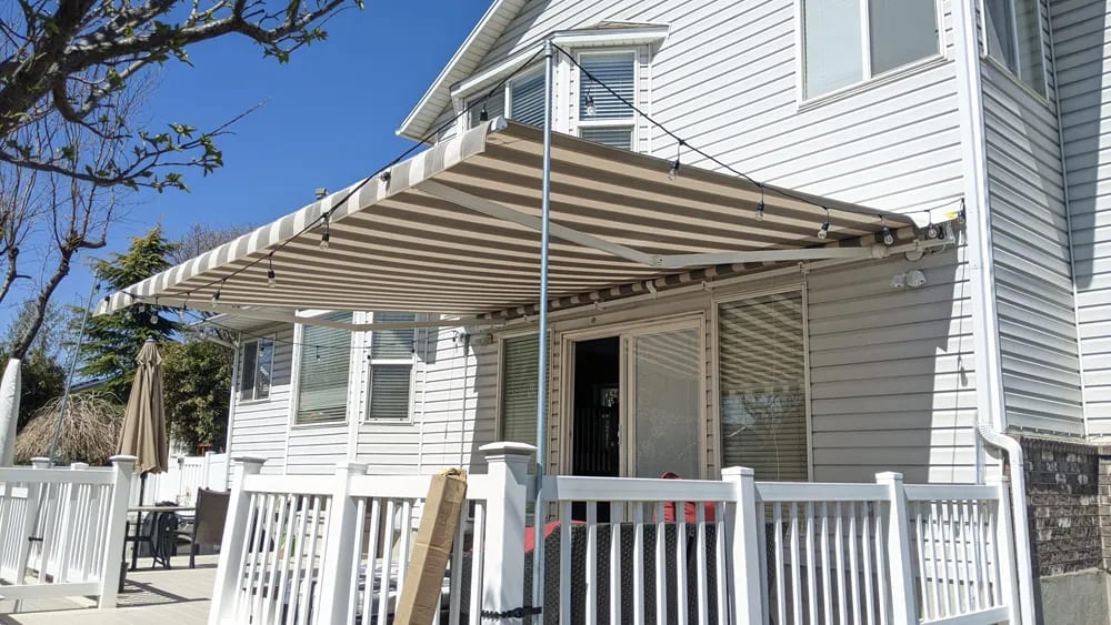 Retractable awning installed on home exterior
