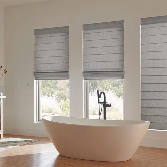 Window coverings behind a soaking tub
