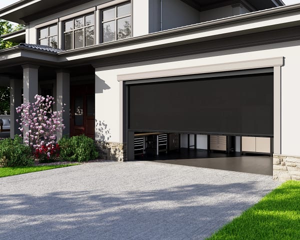 SunSetter PowerScreen with black solar fabric installed over a garage opening